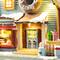 Glitzhome® 10.25" Lighted Christmas Donuts & Coffee Shop Resin Village with Movement and Music